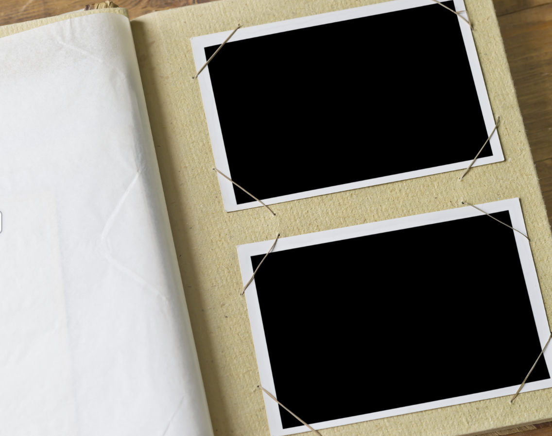 A photo album with blank spaces for images.