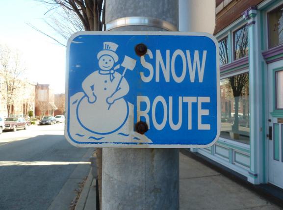 Blue snow route sign.