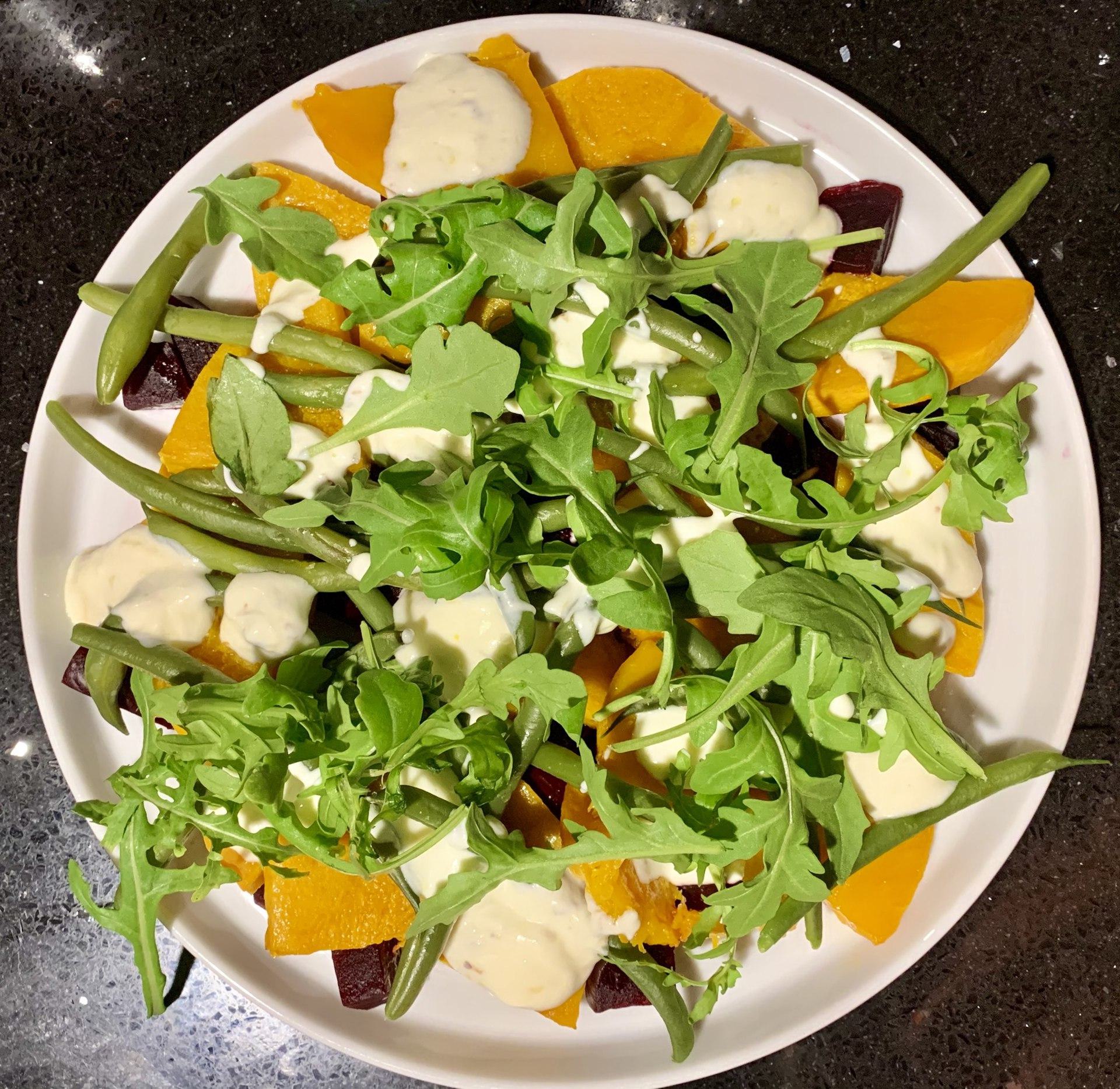 A mixed tossed salad with many ingredients