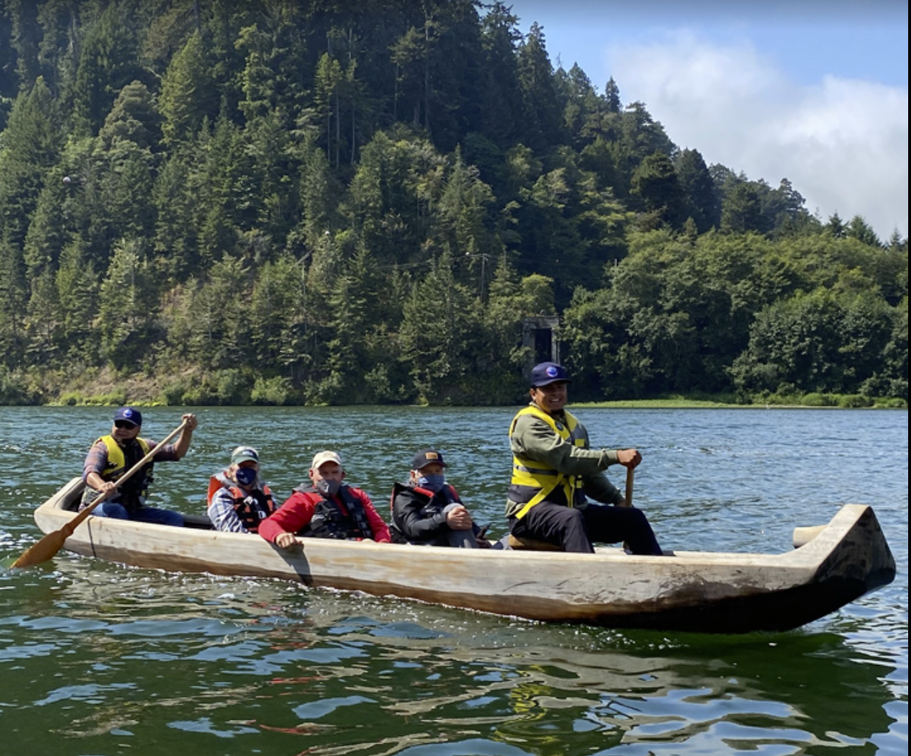 Customers enjoying a guided canoe trip